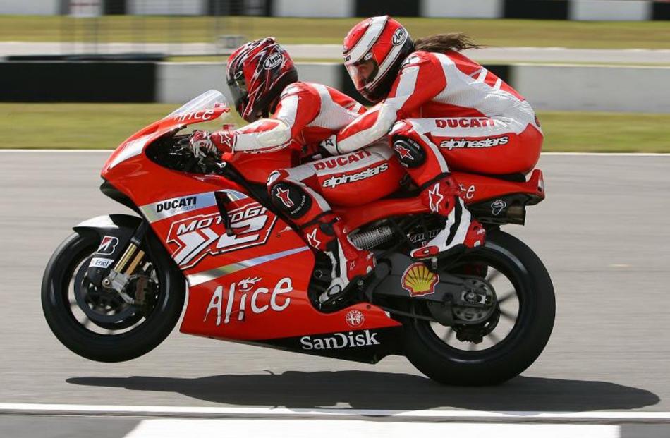 Randy Mamola takes a pillion on a fast lap of Donington Park in England. Photo: Riders for Health