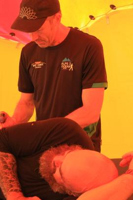 Auckland's Inia Raumati receives treatment from Mike Stewart of the Oamaru Physiotherapy Clinic. Mr Stewart worked a 14-hour day yesterday to deal with a steady stream of athletes at the Alps 2 Ocean Ultra.