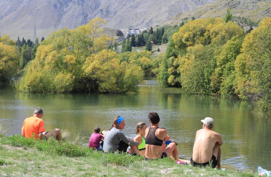 After a 90km stage 3 & 4 run, competitors cool off at Loch Laird. The event has drawn more than 100 athletes from 16 nations to the Waitaki Valley.