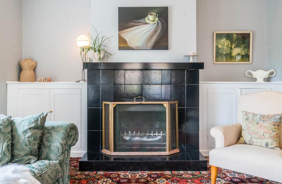 The painting above the fireplace in the formal lounge is Lee Byford’s Dance of the motherhood...