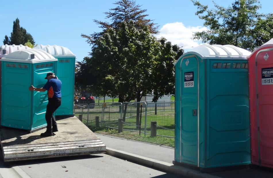 Hirepool's Red Stevenson delivers toilets in McDougall St ahead of the show opening tomorrow.