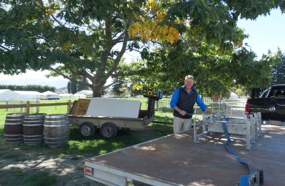 Wanaka's Maude winemaker Dan Dineen drops off wine barrels for the showjumping.