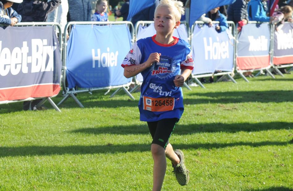 Matthew Hannah (9), of Brighton, heads down the home straight to the finish line yesterday. Photos: Christine O'Connor