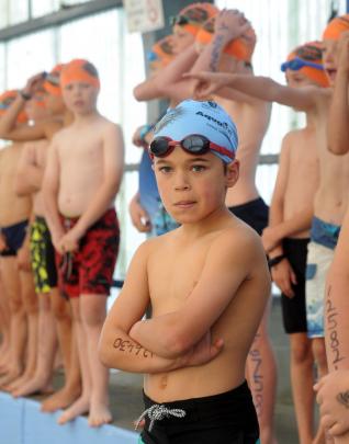 Cameron Naaroa (10), of Dunedin, prepares for the swim leg yesterday.