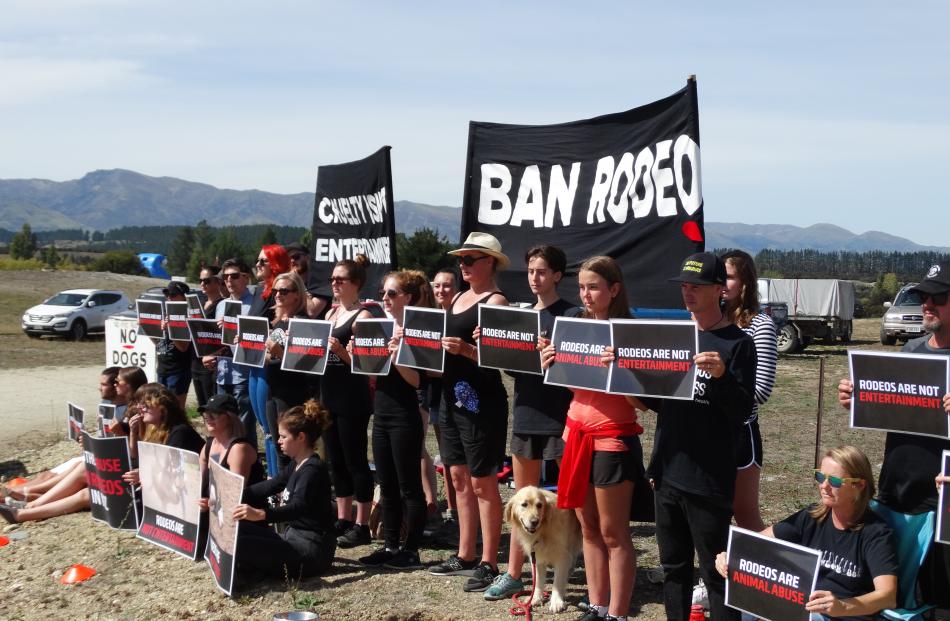 Members of the Animal Justice League NZ gathered at the entrance of the National Finals Rodeo at Wanaka yesterday. Photo: Sean Nugent