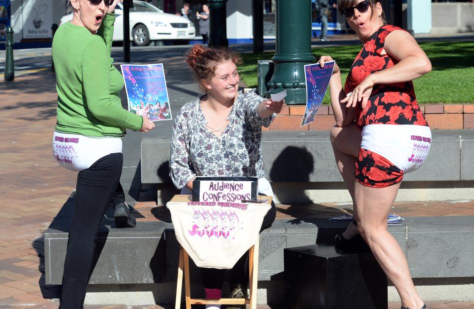 Peppered Unicorn members Jo Ghastly(left), Georgie Sivier and Debbie Klausen, all of Christchurch, advertise their show in the Octagon yesterday.