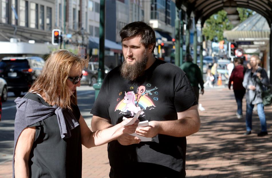 Comedian Dylan Satherley, of Palmerston North, finds a potential audience member in Pamela Jackson yesterday. Photos: Linda Robertson