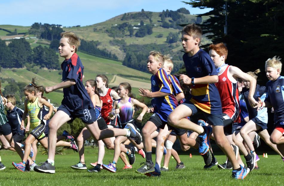 Competitors take off at the start of the year 7 race at the Dunedin primary and intermediate schools triathlon in Port Chalmers yesterday