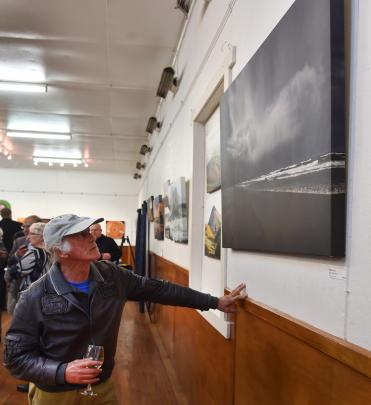 Dunedin artist and exhibition judge Barry Weston looks at photographic work Allans Beach Storm, by John Burke. Photos: Peter McIntosh