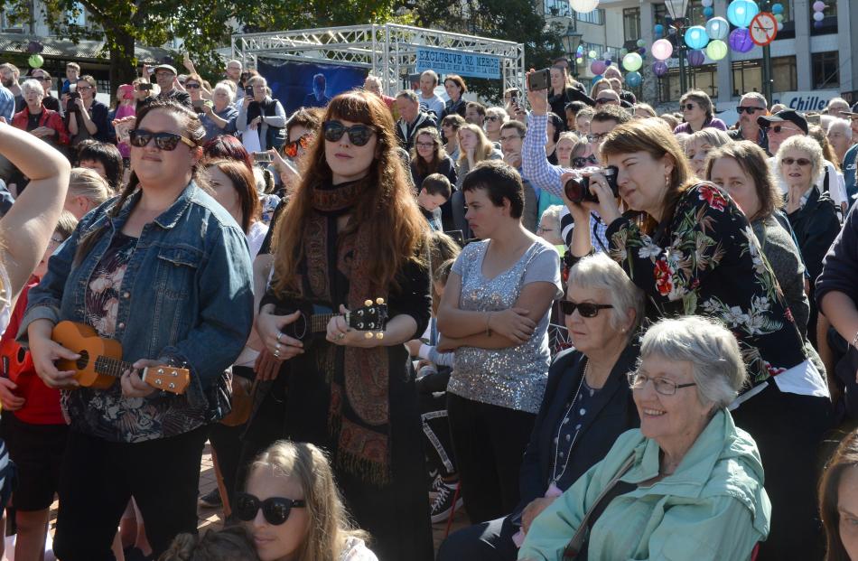 Thousands play songs, some of them from Ed Sheeran's repertoire, on the ukulele in the Octagon this afternoon. Photo: Linda Robertson