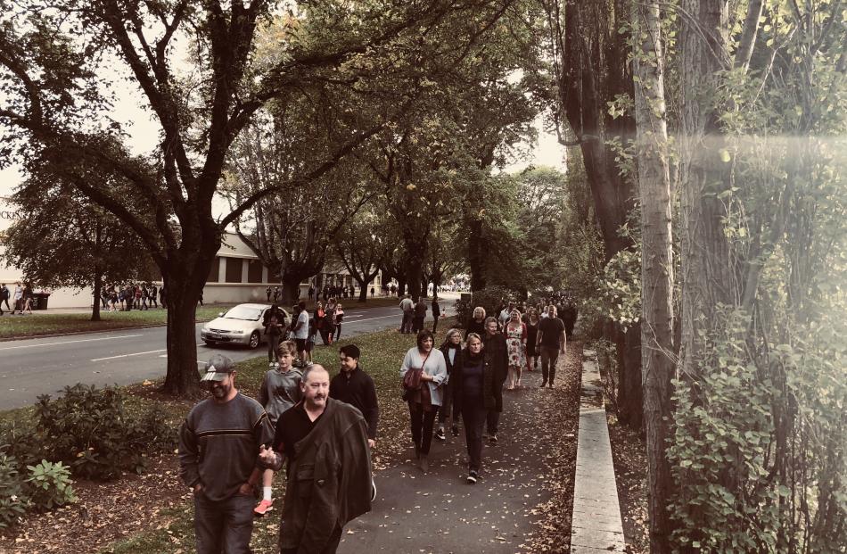 Fans make their way to the stadium along Anzac Ave. Photo: Craig Baxter