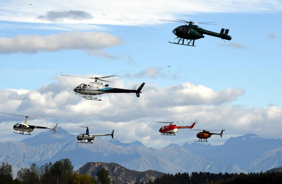 A squadron of helicopters fly over Wanaka Warbirds today. Photo: Stephen Jaquiery