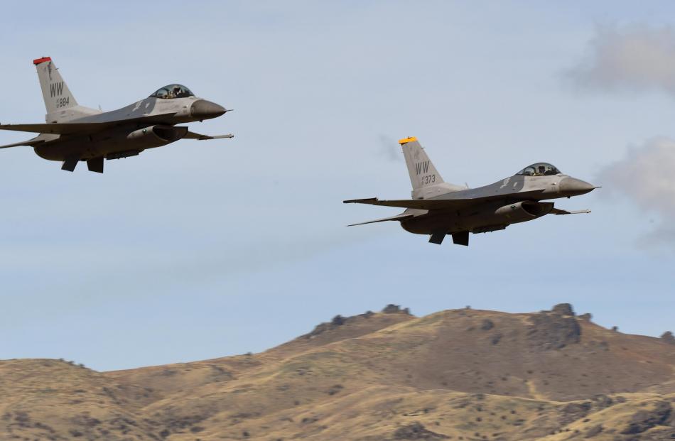 Capable of flying at Mach 2, United States Air Force F-16s do a slow pass over Wanaka Airport.