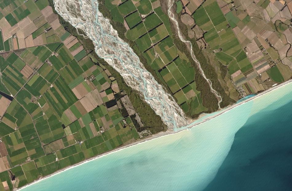 The braided Rakaia River carries glacial runoff from New Zealand’s Southern Alps to the Pacific...
