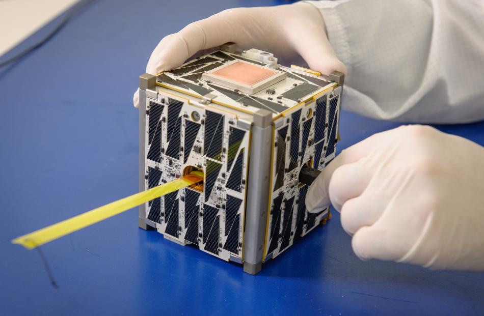 A cubesat like the ones built and used by Spire Global Inc, ‘‘a leading space-to-cloud data...