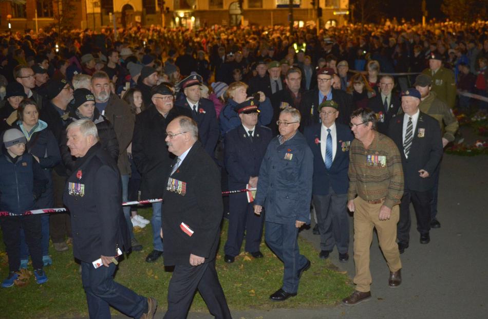 Veterans march onto Queens Gardens at the commencement of this morning's dawn service in Dunedin....