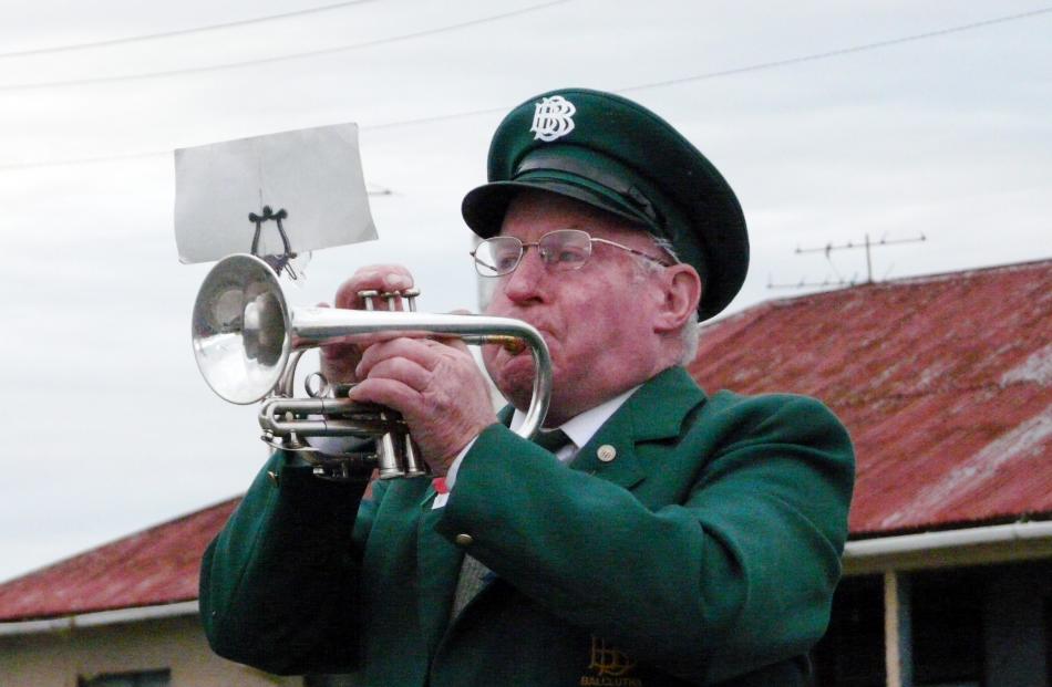 Balclutha Brass Band bugler Warrick Thomson plays the Last Post at the dawn service in Balclutha....