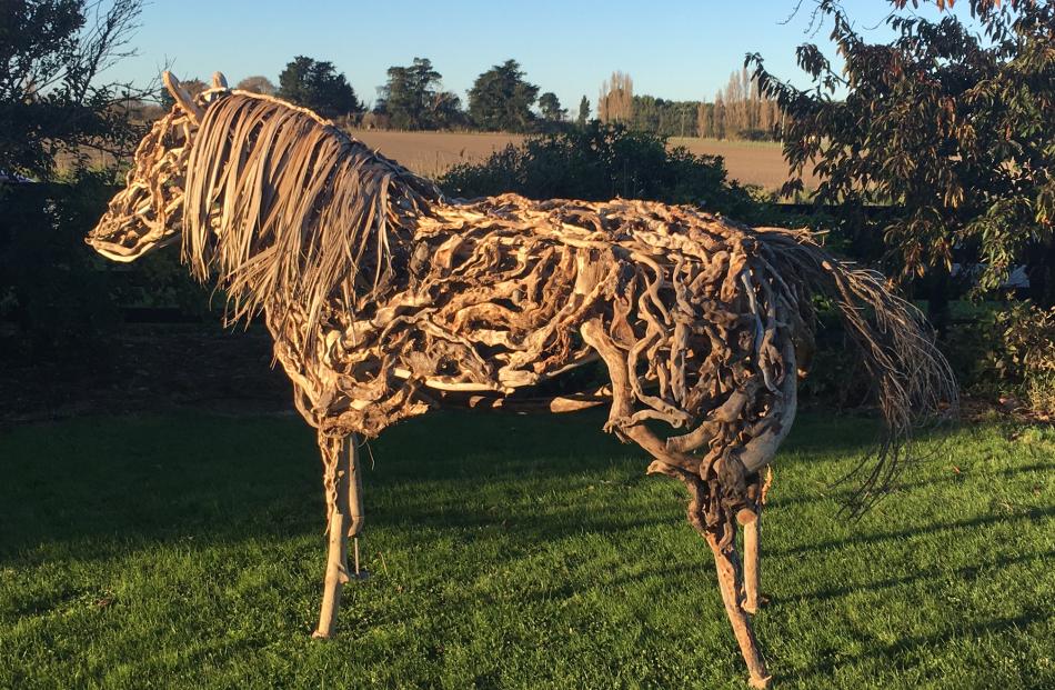 Greg Powell’s latest work is a life-sized horse standing in the front yard. Photo: Supplied