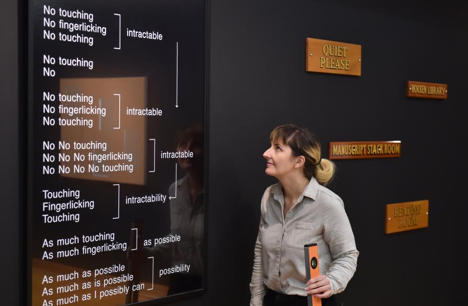 Curator Andrea Bell with works from the ‘‘The Order of Things’’ at the Hocken Library. Photo: Gregor Richardson