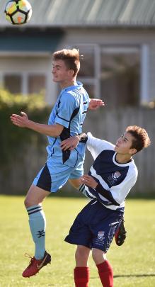 King’s player Jed Collings gets up higher than his opponent, Josh Potter, during the First XI game at Tonga Park