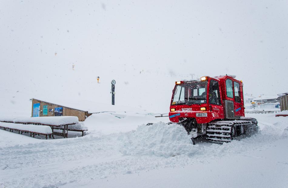 Snow plough scoops the snow at Coronet Peak ski field. Photo: Chris Hoopmann