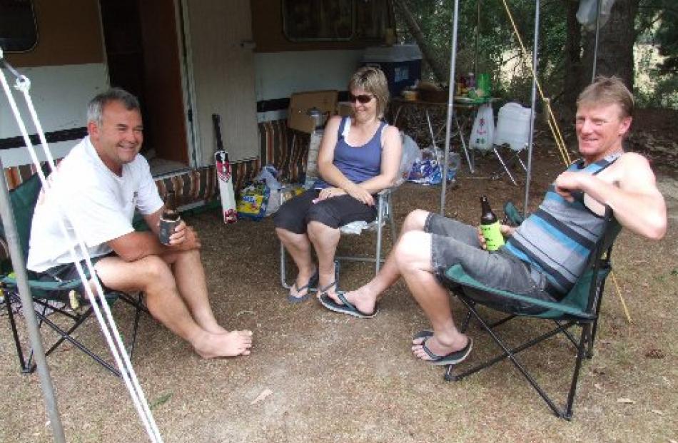 Bill Young, Sally Cunningham and Ted Cunningham, all from Oamaru, relax at the Herbert Forest...