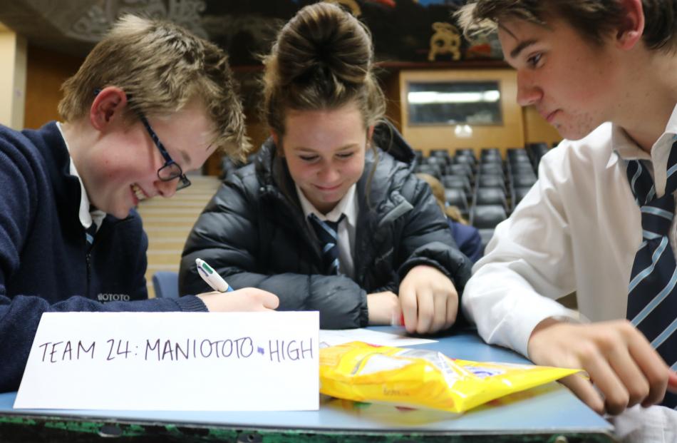 Ben Voice, Tyla Spooner and Dylan Connell (all 14), of Maniototo Area School, deliberate over a...