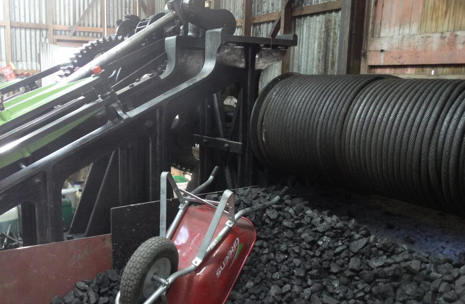 Coal storage space and the winch used to pull the ship  from the lake.