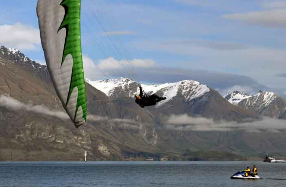 In-coming . . . Parapenter Dan Stephens, from Queenstown, puts on a show as he entertains the...