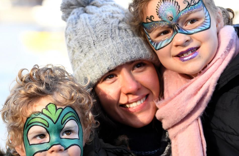 Brisbane family James (2), Tenealle and Olivia (7) Culhane watch the winter festival activities.