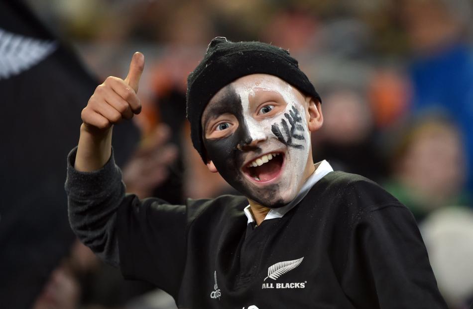 Fans  support  their teams during the third test in Dunedin on Saturday. Photos: Peter McIntosh