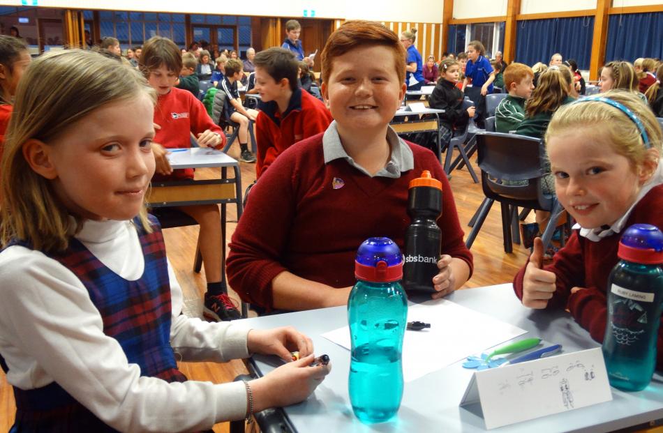 St Joseph's Timaru pupils (from left) Rose Doran (9), Lui Tupola (10) and Ruby Laming (9) put...