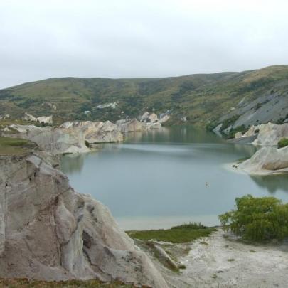 Dramatic cliffs border the distinctive Blue Lake