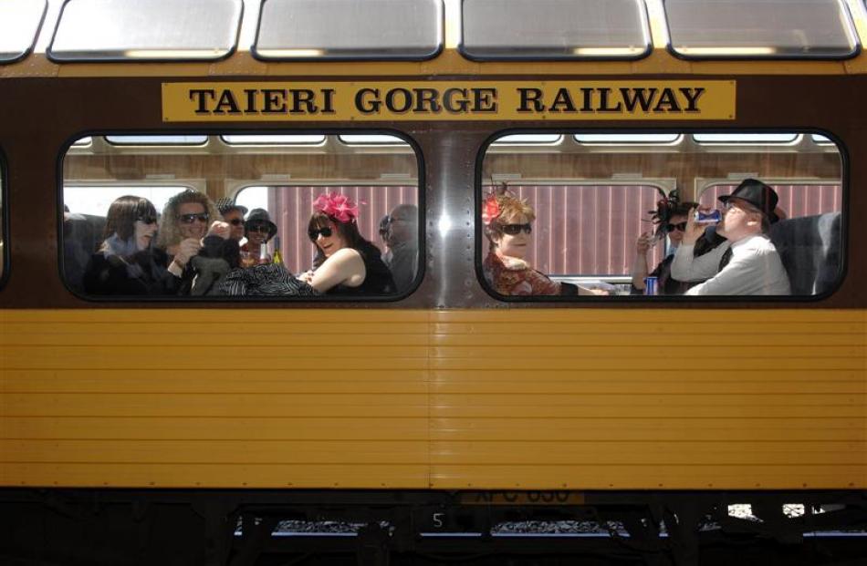 On board the Taieri Gorge Train bound for the Wingatui races on Tuesday, November 2, are (from...