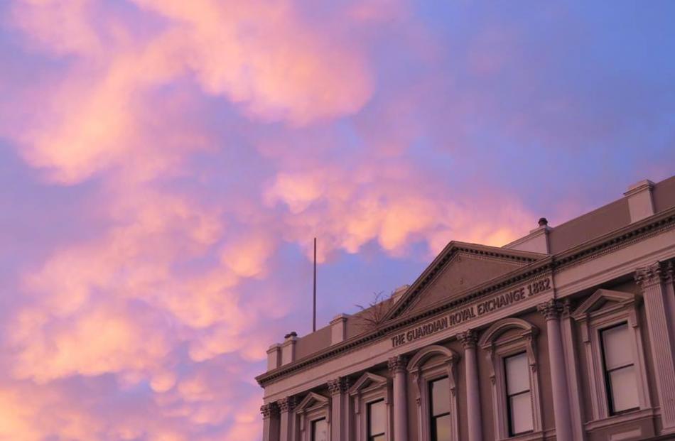 Pink clouds float over The Exchange in Dunedin. Photo: Caz Rickerby