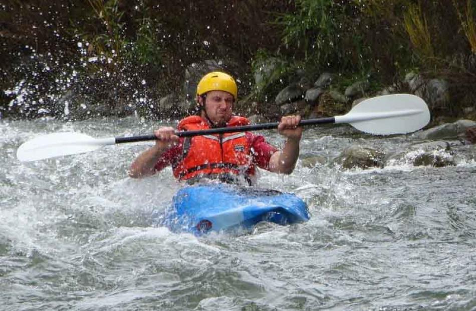 Unseasonal . . . Blair Olsen, of Dunedin, enjoys high water flow in the Otematata River. Photo:...