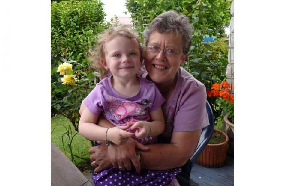 Cuddles for Christmas . . . Jan Lyall and grand-daughter Sequoia Lyall (4), in Mosgiel. PHOTO:...