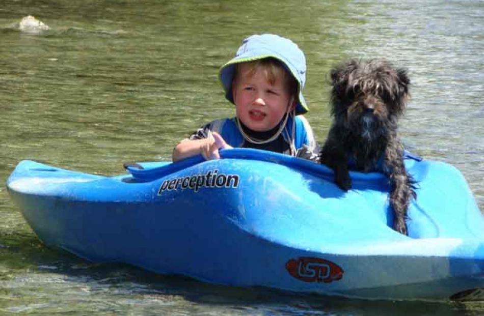 Enjoying the sun . . . Danny Olsen (2), of Dunedin, with dog Ollie at Otematata, Photo: Kirsten...