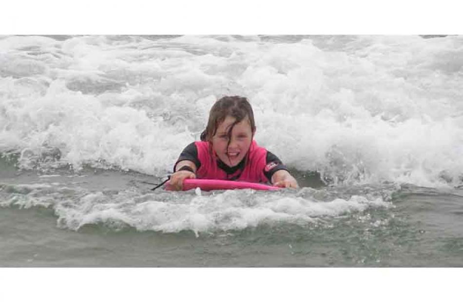 Emily Paterson (10) enjoying the waves at Brighton Beach. Credit: Glenda Paterson.
