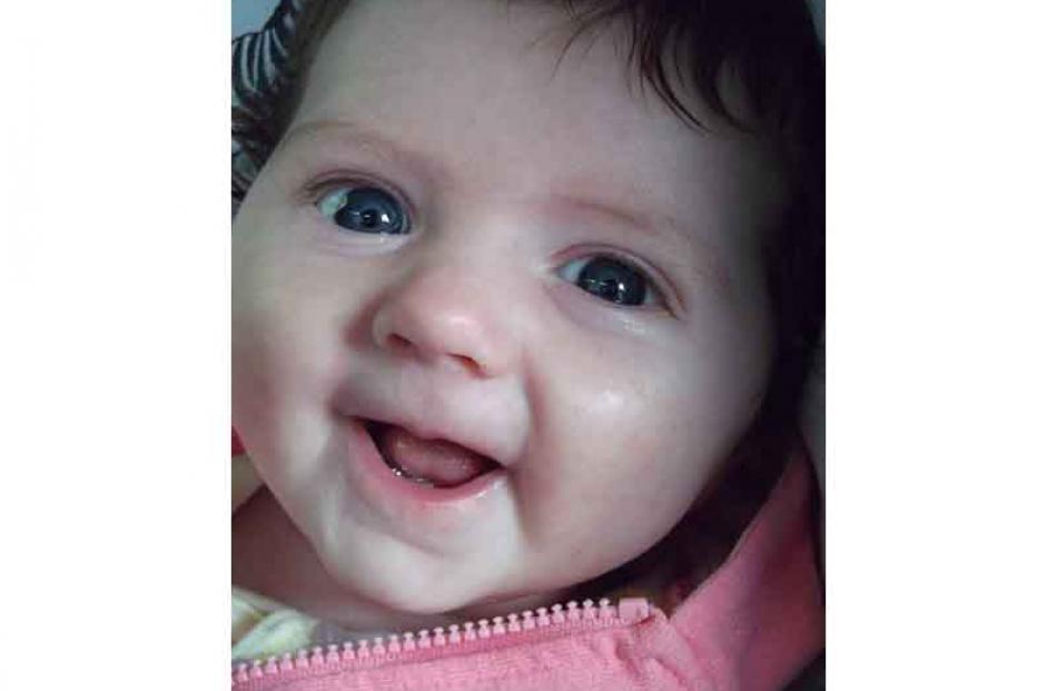 Baby's first smiles . . . Rita Booth (10 weeks) on 28 December. Photo: Allison Booth