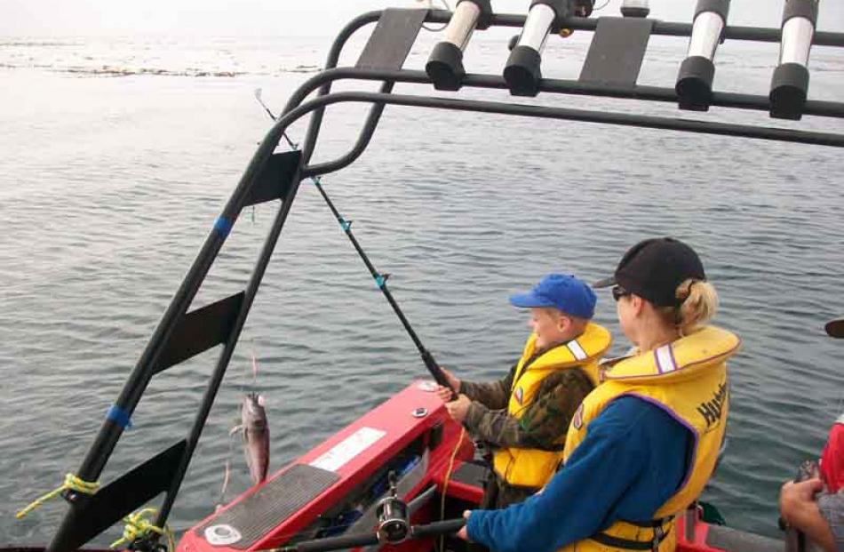 Harry Brenssell 9yrs old with mum Di Brensell, catching blue cod at Shag Point on 4th Jan. Photo:...