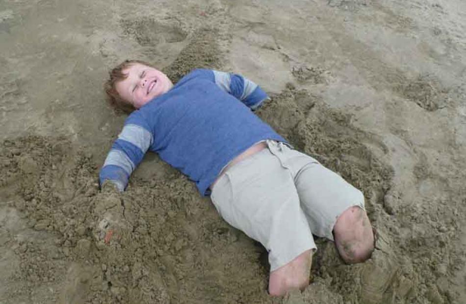 Look, no hands . . . Fraser McAtamney (6) plays in the sand at Papatowai beach in the Catlins on...