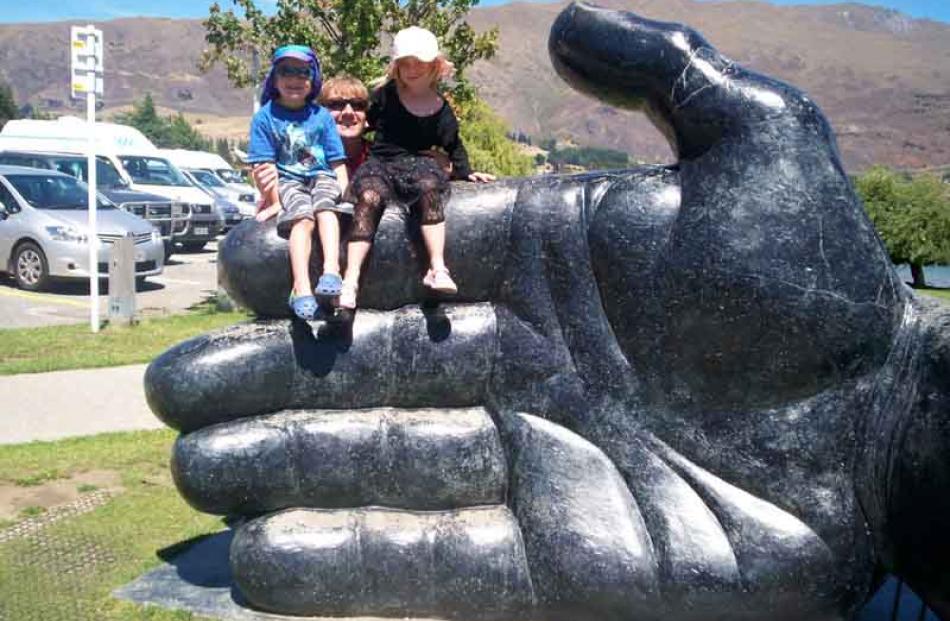 Hand-held photo . . . Joshua Buchanan (4), Matt Buchanan and Isabella Buchanan (6) in Wanaka on...