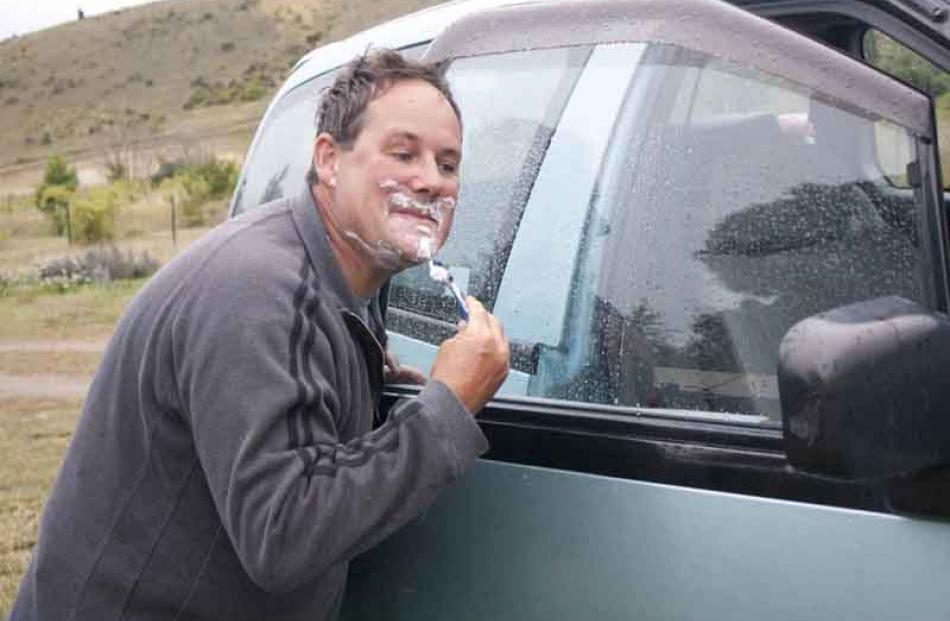 Having a shave freedom camping way, lake Aviemore and yes it was raining 5th Jan 2011 Howard...