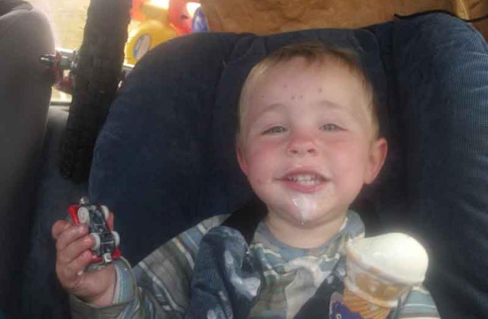 Time for a cool off . . . Crawford Merriman (2), of Dunedin, enjoys an ice-cream to cool off...
