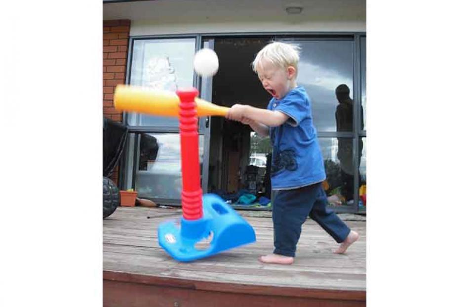 Strike one . . . Joshua Smith (2) plays T-ball on Christmas Day at The Wandle, near Middlemarch....