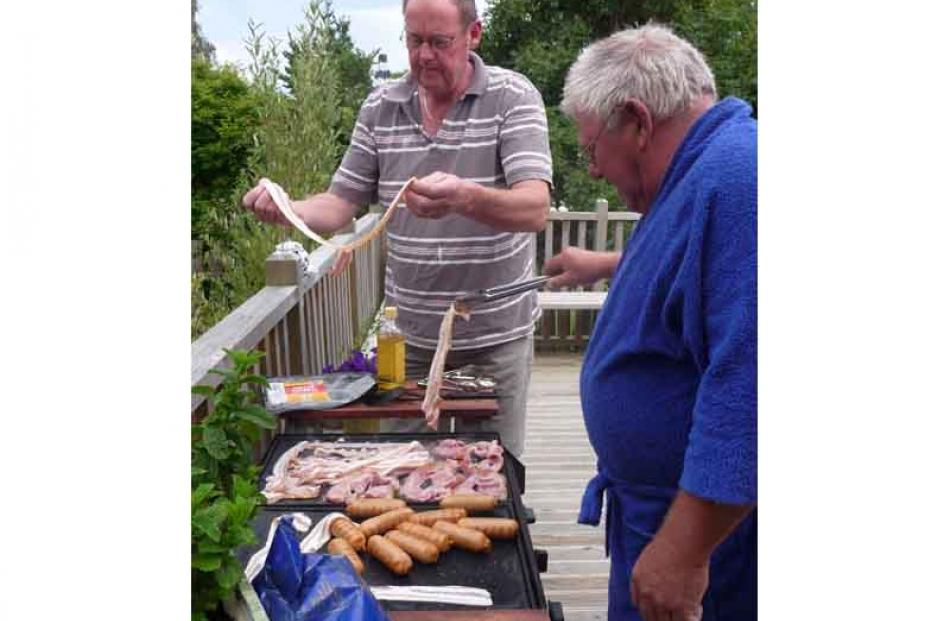 Geoff Davis, Palmerston and Trevor Young of Cromwell prepare 'the good old kiwi breakie'.Photo:...