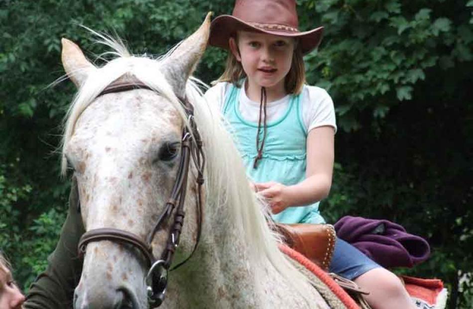 Megan Hanning (7 years) on horse "Bro" at the top of the Danseys Pass at New Year. A surprise...