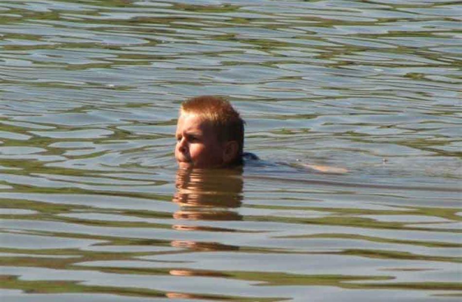 Enjoying the water . . . Cory May (11) at the Pounawea Elbow on Sunday. Photo: Wilma Sharp