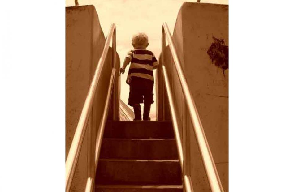 First time . . . Jacob McInnes (20 months) advances up the 'shoe' slide at Marlow Park, Dunedin,...